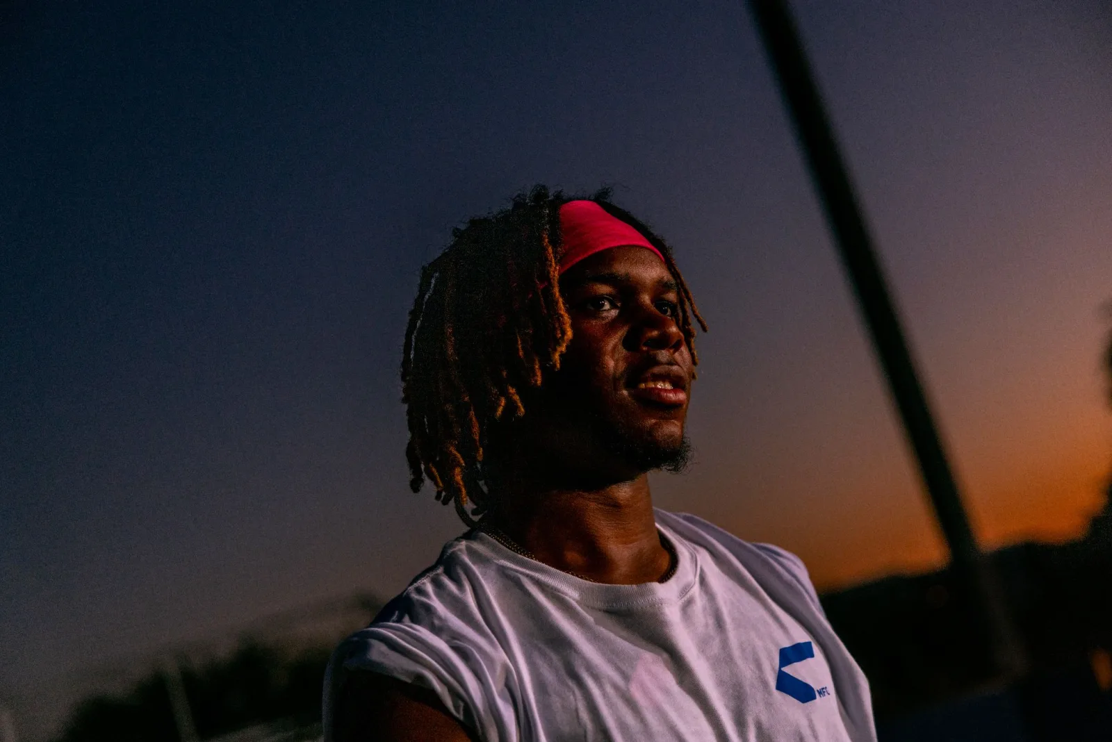 Athlete in a Combat jersey at dusk